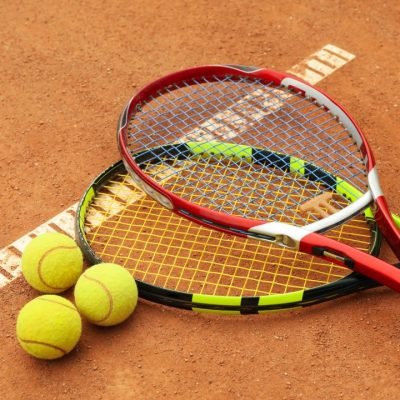 tennis-racquets-with-tennis-balls-on-clay-court.jpg tennis-racquets-with-tennis-balls-on-clay-court.jpg
